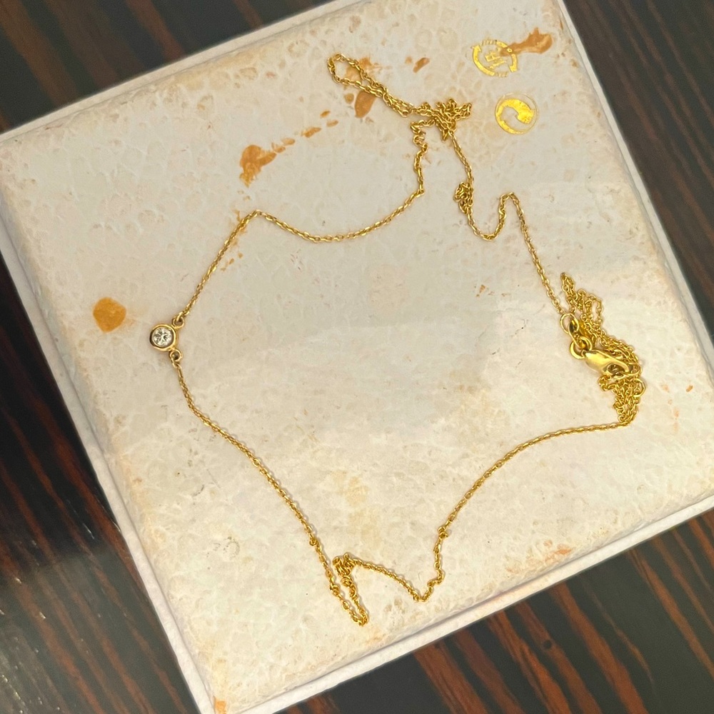 Dainty 14k gold necklace with single diamond